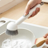 Brosse vaisselle avec réservoir