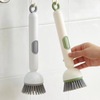 Brosse vaisselle avec réservoir